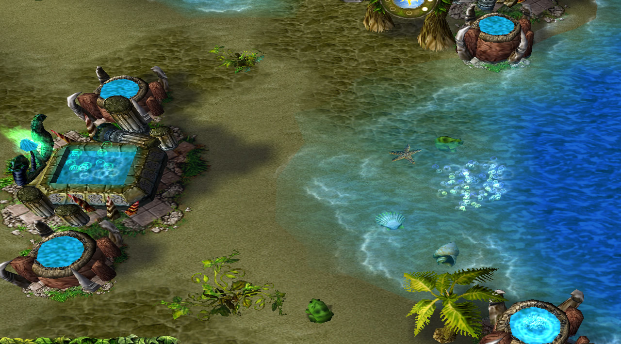 A naga temple surrounded by towers sits on a sandy shore, with the sea in view. A patch of bubbles is visible in the water