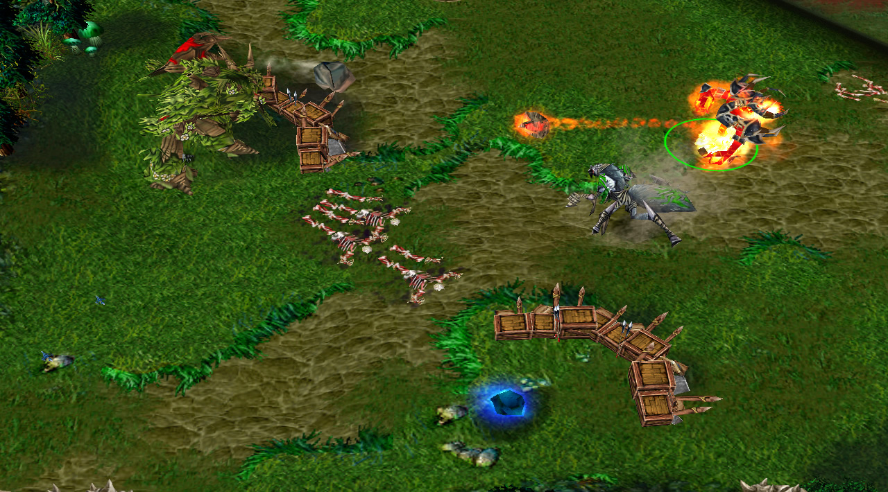 A firelord hero attacks an Elf tower, while a blue crystal floats in the vacant spot next to it where a tower previously stood