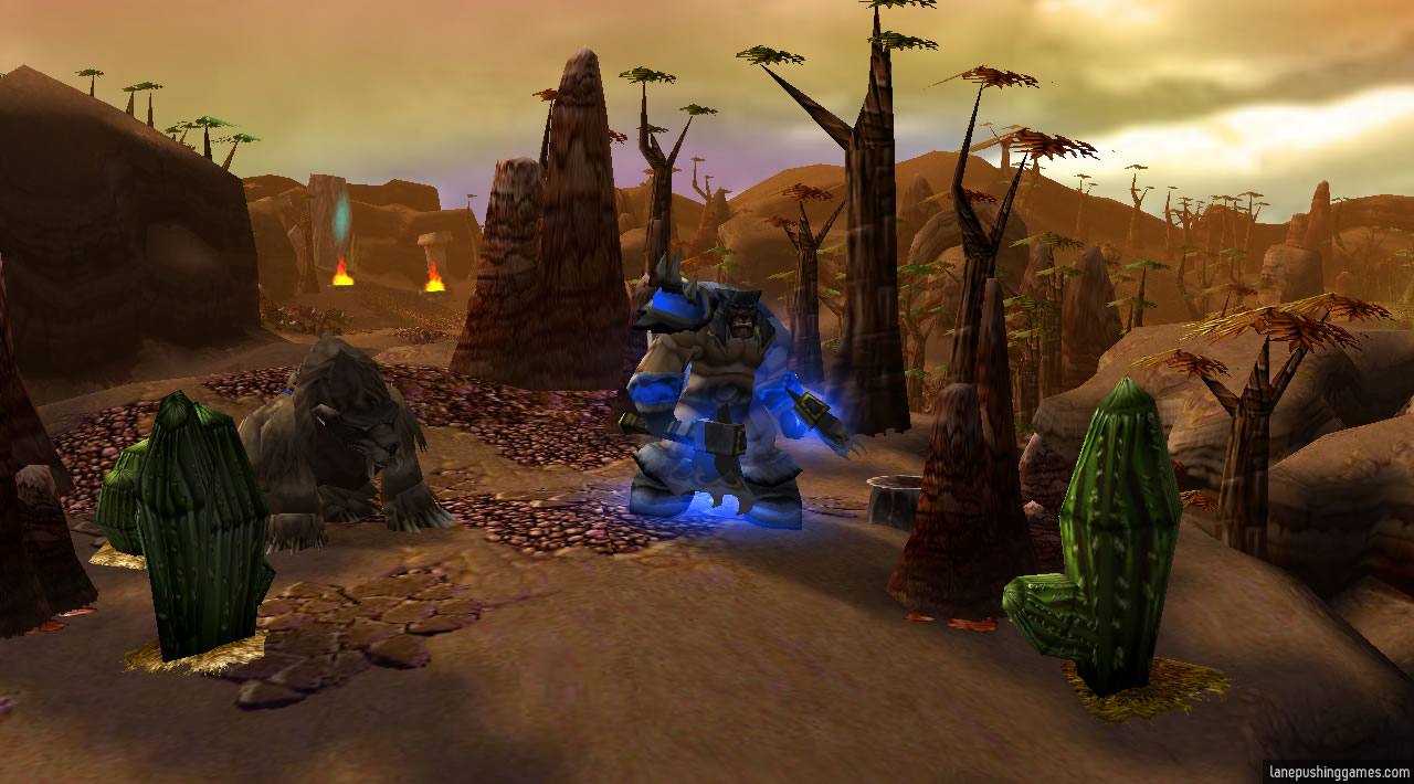 Rexxar stands upon a desert cliff, accompanied by his trusty bear Misha