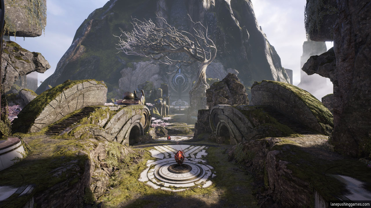 Moss-covered rocks and ruins border a relatively straight path to a monument in the distance